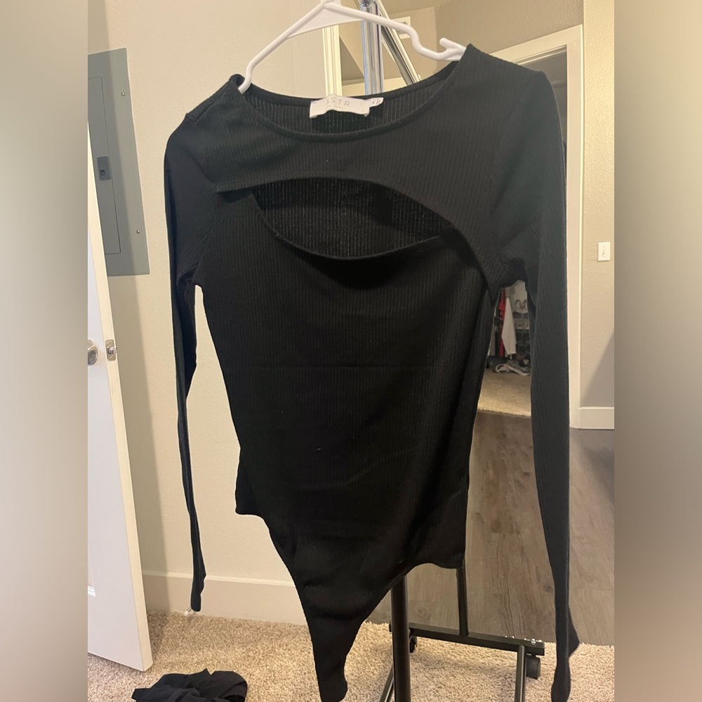 Black bodysuit with cut out in the front. Long sleeve. Very warm and cozy